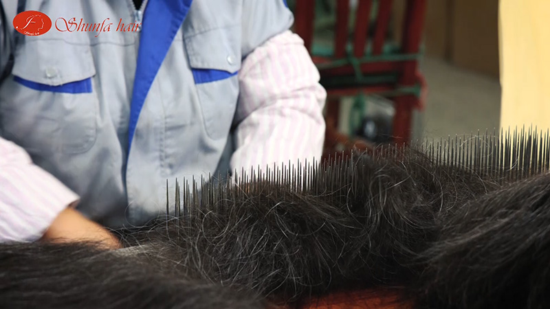 16. picking the grey hair out of the bunch of hair